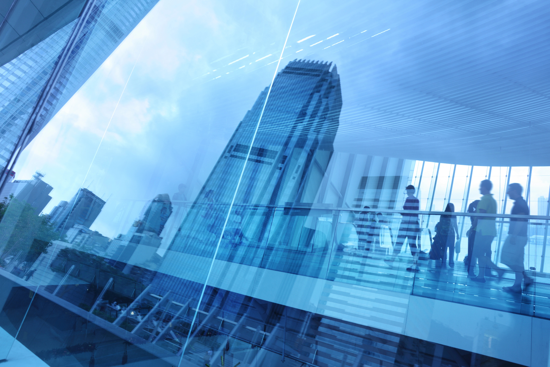 Modern glass skyscrapers and professionals — backdrop for client coverage